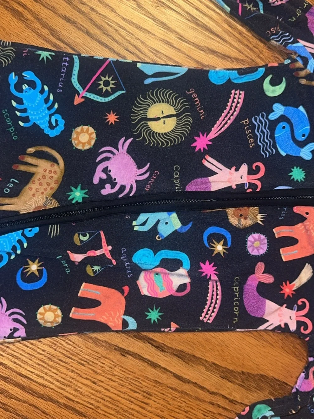 Little Sleepies Black Zodiac Print Footie with Colorful Accents